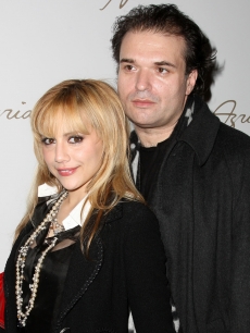 Brittany Murphy and husband Simon Monjack get close backstage at the Max Azaria show at Bryant Park during Mercedes-Benz Fashion Week in NYC on February 4, 2008