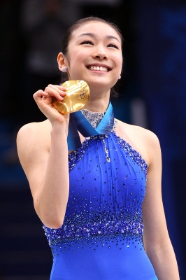 Kim Yu-Na of South Korea celebrates winning the gold medal in the Ladies Free Skating during the medal ceremony on day 14 of the 2010 Vancouver Winter Olympics at Pacific Coliseum on February 25, 2010
