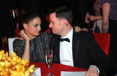 Nicole Richie and Joel Madden get cozy inside the 18th Annual Elton John AIDS Foundation Oscar Party at Pacific Design Center on March 7, 2010 in Los Angeles
