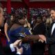Billy Bush is on hand as Gabourey Sidibe and Gerard Butler have their second meeting (on the Oscars red carpet), LA, March 7, 2010
