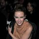 Kylie Minogue sits in the front row of the Yves Saint-Laurent Ready to Wear show during Paris Fashion Week, Feb. 8, 2010