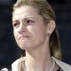 ESPN reporter Erin Andrews grimaces during a news conference about the sentencing of her stalker outside the U.S. District Court in downtown Los Angeles on March 15, 2010
