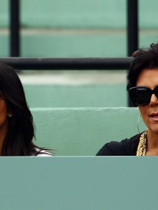 Kim Kardashian and her mother Kris Jenner look stylish in their shades as they watch the 2010 Sony Ericsson Open at Crandon Park Tennis Center in Key Biscayne, Fla. on March 29, 2010