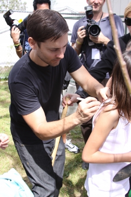 Tobey Maguire signs signatures at the launch of  ‘Teaching Garden’ in Inglewood, Calif. on March 22, 2010.