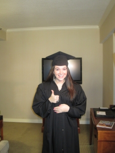 “American Idol” season nine contestant Katie Stevens poses in a cap and gown