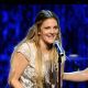Drew Barrymore accepts the 2010 Vanguard Award onstage at the 21st Annual GLAAD Media Awards held at Hyatt Regency Century Plaza Hotel in Los Angeles, California on April 17, 2010 