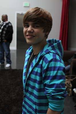 Justin Bieber smiles on his way to the recording studio for a segment in ‘Maria’s Madcap Adventures’ with Maria Menounos