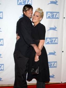 Carey Hart and Pink hug for the PETA Gala press, 2005