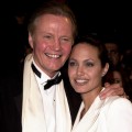 Jon Voight and daughter Angelina Jolie cuddle up at the Vanity Fair Oscar Party, March 25, 2010
