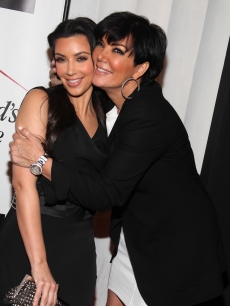 Kim Kardashian and Kris Jenner share a moment a clothing drive benefiting ‘My Friend’s Place’ hosted by Kelly Osbourne at MI-6 in West Hollywood, California on May 26, 2010 