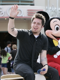 Newly crowned “American Idol” Lee DeWyze takes a celebratory ride May 31, 2010 with Mickey Mouse through Disney’s Hollywood Studios theme park in Lake Buena Vista, Fla. In addition to the parade at Disney’s Hollywood Studios, DeWyze made a surprise appearance on-stage at “The American Idol Experience,” the theme park’s attraction based on the hit TV show. 