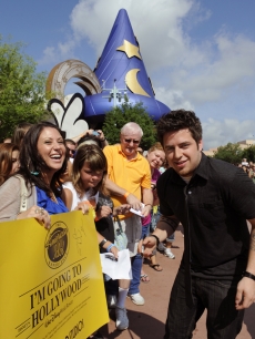 Newly crowned “American Idol” Lee DeWyze takes a celebratory ride May 31, 2010 with Mickey Mouse through Disney’s Hollywood Studios theme park in Lake Buena Vista, Fla. In addition to the parade at Disney’s Hollywood Studios, DeWyze made a surprise appearance on-stage at “The American Idol Experience,” the theme park’s attraction based on the hit TV show. 