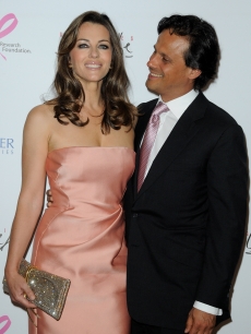 Elizabeth Hurley and husband Arun Nayar attend the Evelyne H. Lauder photo Exhibition at Galeries Lafayette, Paris, France, June 1, 2010