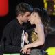 Robert Pattinson and Kristen Stewart lock lips on stage at the 2010 MTV Movie Awards in Los Angeles