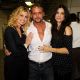 Faith Hill, Tim McGraw and Sandra Bullock pose for a group photo at Nashville Rising, a benefit concert for flood relief at Bridgestone Arena in Nashville, Tennessee on June 22, 2010
