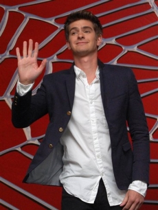 Andrew Garfield waves and flashes a smile at photographers as he is announced as the new “Spider-Man” during a media event in Cancun, Mexico, 1 July 2010