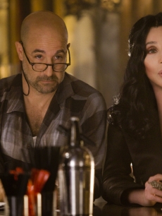Cher and Stanley Tucci have a drink together in the new film “Burlesque”