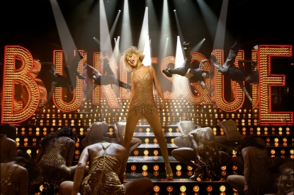 Christina Aguilera goes gold and glamorous in her new film “Burlesque”