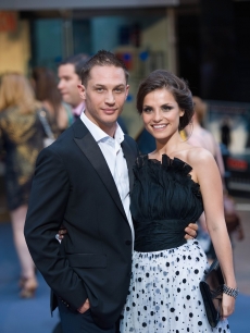    Tom Hardy and fiancee Charlotte Riley pose for the cameras at the London premiere for “Inception” at the Odeon Leicester Square in London, England on July 8, 2010