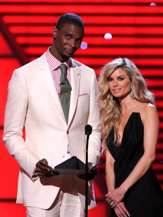 NBA star Chris Bosh of the Miami Heat and model Marisa Miller speak on stage during the ESPY Awards at Nokia Theatre L.A. Live in Los Angeles on July 14, 2010

