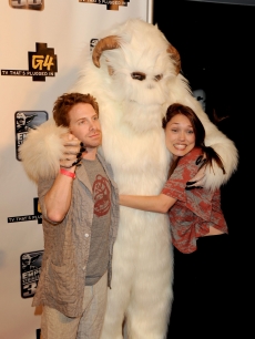 Seth Green and Clare Grant pose with a furry creature at the “GPhoria Strikes Back” party hosted by G4 and Lucasfilm during Comic-Con International at the Hard Rock Hotel in San Diego, Calif., on July 22, 2010
