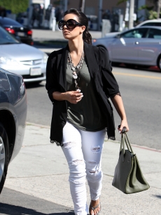 Kim Kardashian steps out in ripped jeans in Beverly Hills, July 29, 2010