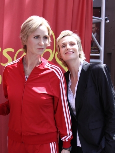 Jane Lynch poses next to the wax figure of her “Glee” character, Sue Sylvester, at Madame Tussauds in Hollywood, Calif., on August 4, 2010