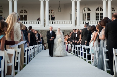 Former President Bill Clinton walks daughter Chelsea Clinton down the aisle at her wedding to Marc Mezvinsky at the Astor Courts Estate on July 31, 2010 in Rhinebeck, New York
