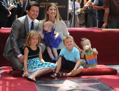 Doting dad Mark Wahlberg poses with his family — wife Rhea Durham, Ella, Grace, Michael and Brendan — as he receives his Walk of Fame star, LA, July 29, 2010