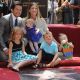 Doting dad Mark Wahlberg poses with his family — wife Rhea Durham, Ella, Grace, Michael and Brendan — as he receives his Walk of Fame star, LA, July 29, 2010