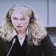 Mia Farrow is seen on a screen in the pressroom of the U.N.-backed Special Court for Sierra Leone in Leidschendam, Netherlands on August 9, 2010