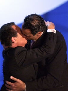 Garry Shandling kisses Emmy Nominee Brad Garrett at the 55th Annual Primetime Emmy Awards in 2003