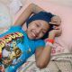 Shannon Tavarez relaxes in her room in the Queens Borough of New York on July 15, 2010