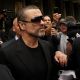 George Michael is seen leaving Highbury Corner Magistrates Court with his personal security in London, England on August 24, 2010