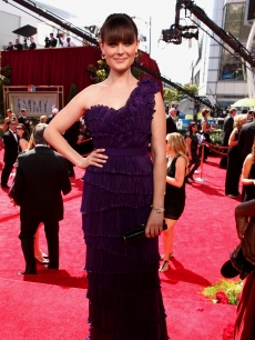 “Bones” star Emily Deschanel poses on the NBC platform at the Emmys, LA, Aug. 29, 2010