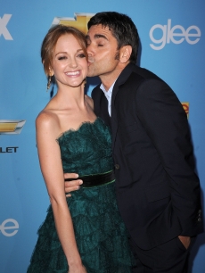 Jayma Mays and John Stamos share a kiss at the “Glee” Season 2 premiere held at Paramount Studios in Hollywood on September 7, 2010 