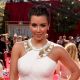 Kim Kardashian poses on Access Hollywood’s platform at the Emmys, LA, Aug. 29, 2010