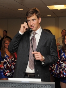 Eli Manning makes trades during the 6th Annual BGC Charity Day at BGC Partners, INC, NYC, September 13, 2010