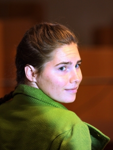 Defendant Amanda Knox takes a seat next to her lawyers on the final day of the Meredith Kercher murder trial in Perugia, Italy, December 4, 2009