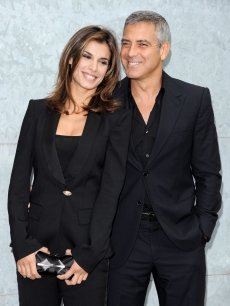 Elisabetta Canalis and George Clooney attend the Giorgio Armani Spring/Summer 2011 fashion show during Milan Fashion Week Womenswear in Milan, Italy on September 27, 2010 
