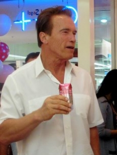 Arnold Schwarzenegger sips on O.N.E. Coconut Water at an event celebrating daughter Katherine’s book, “Rock What You’ve Got,” Santa Monica, Sept. 25, 2010