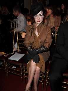 Dita Von Teese attends the John Galliano Ready to Wear Spring/Summer 2011 show during Paris Fashion Week at Opera Comique in Paris, France, on October 3, 2010 
