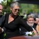 Jamie Lee Curtis places a flower on the casket of her father, Hollywood legend Tony Curtis, at the Palm Mortuary and Cemetery, Green Valley in Las Vegas on October 4, 2010