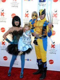 Tori Spelling (as a peacock), daughter Stella, son Liam, and Dean McDermott (as Wolverine) arrive at the Children Affected By AIDS Foundation’s 17th Annual Dream Halloween event at Barker Hanger in Santa Monica on October 30, 2010 