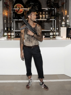Maroon 5 frontman Adam Levine dresses up as Bruce Willis’ “Die Hard” character John McClane at Bacardi’s Halloween bast at the Hollywood Forever Cemetery in LA on October 31, 2010