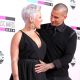 Carey Hart pats wife Pink’s pregnant tummy at the 2010 American Music Awards held at Nokia Theatre L.A. Live in Los Angeles on November 21, 2010