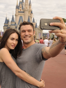 Brian Austin Green and Megan Fox take a souvenir photo Disney World in Lake Buena Vista, Florida on November 26, 2010 