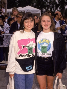 Danica McKellar and Crystal McKellar stand with their arms around each other at Earth Walk, 1992