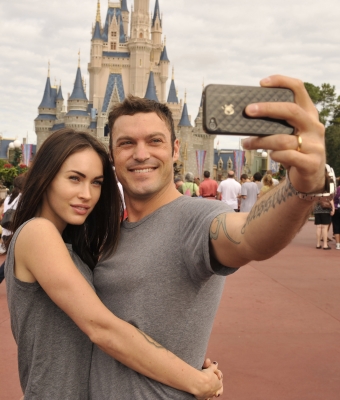 Brian Austin Green and Megan Fox take a souvenir photo Disney World in Lake Buena Vista, Florida on November 26, 2010 