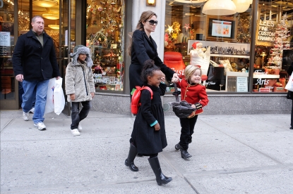 Maddox Jolie-Pitt, Angelina Jolie, Zahara Jolie-Pitt, and Shiloh Jolie-Pitt leave Lee’s Art Shop, New York City, December 7, 2010